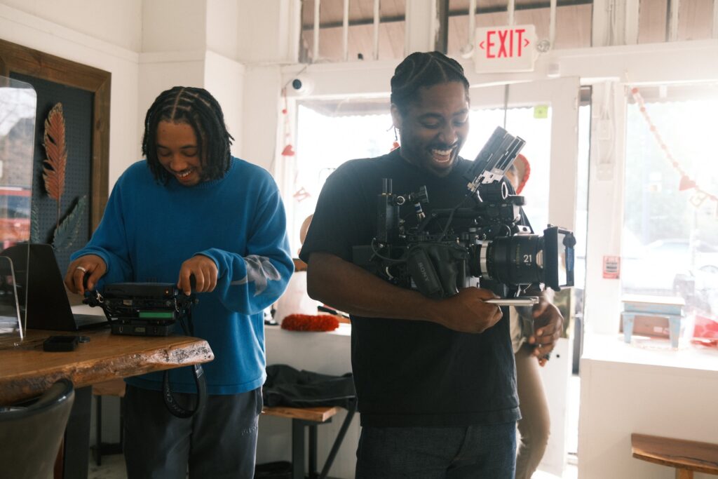 Photo of Christopher Nolan Jones and his camera operator on set for filming his Storyblocks Re: Stock collection.