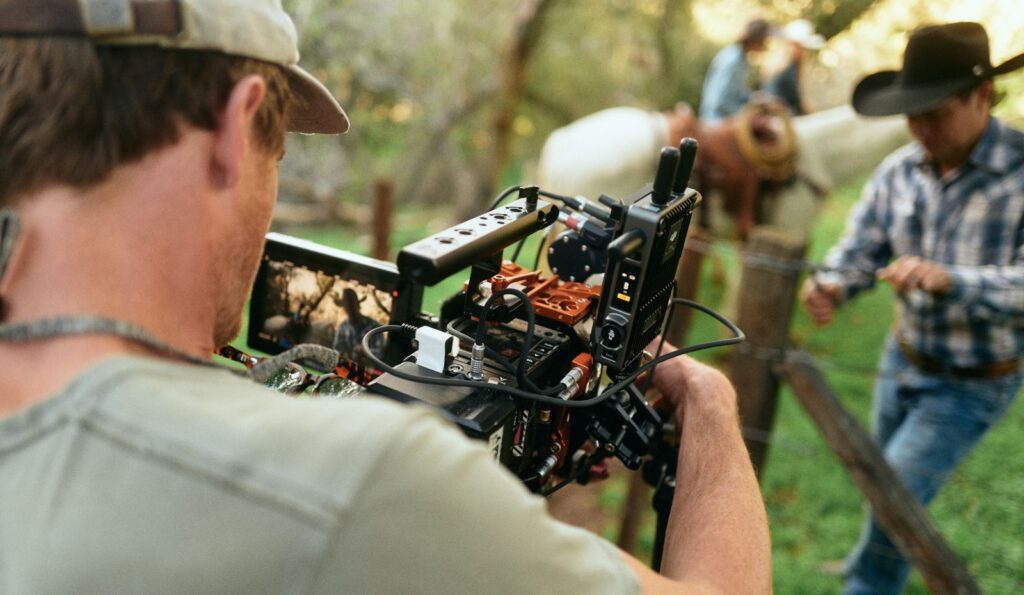 Over the shoulder image of filmmaker and Re: Stock artist Kristofer Evered filming in Corral de Tierra, California for his footage collection.